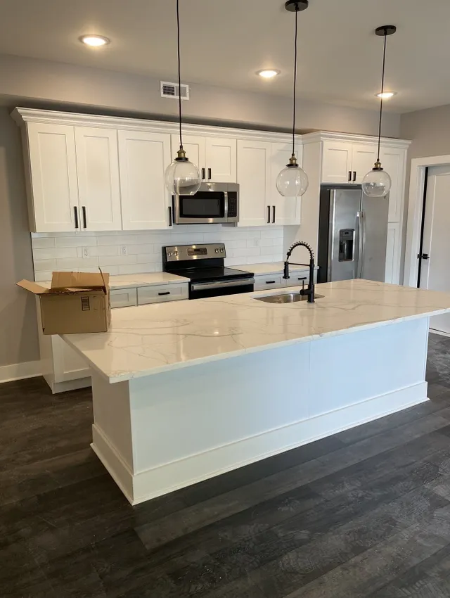 remodeled kitchen with white cabinets