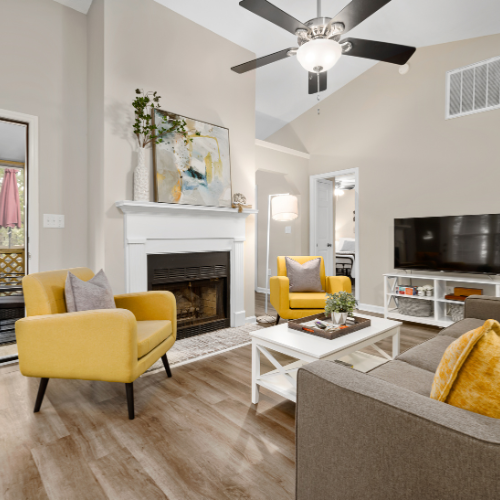 living room with white painted walls and yellow furniture