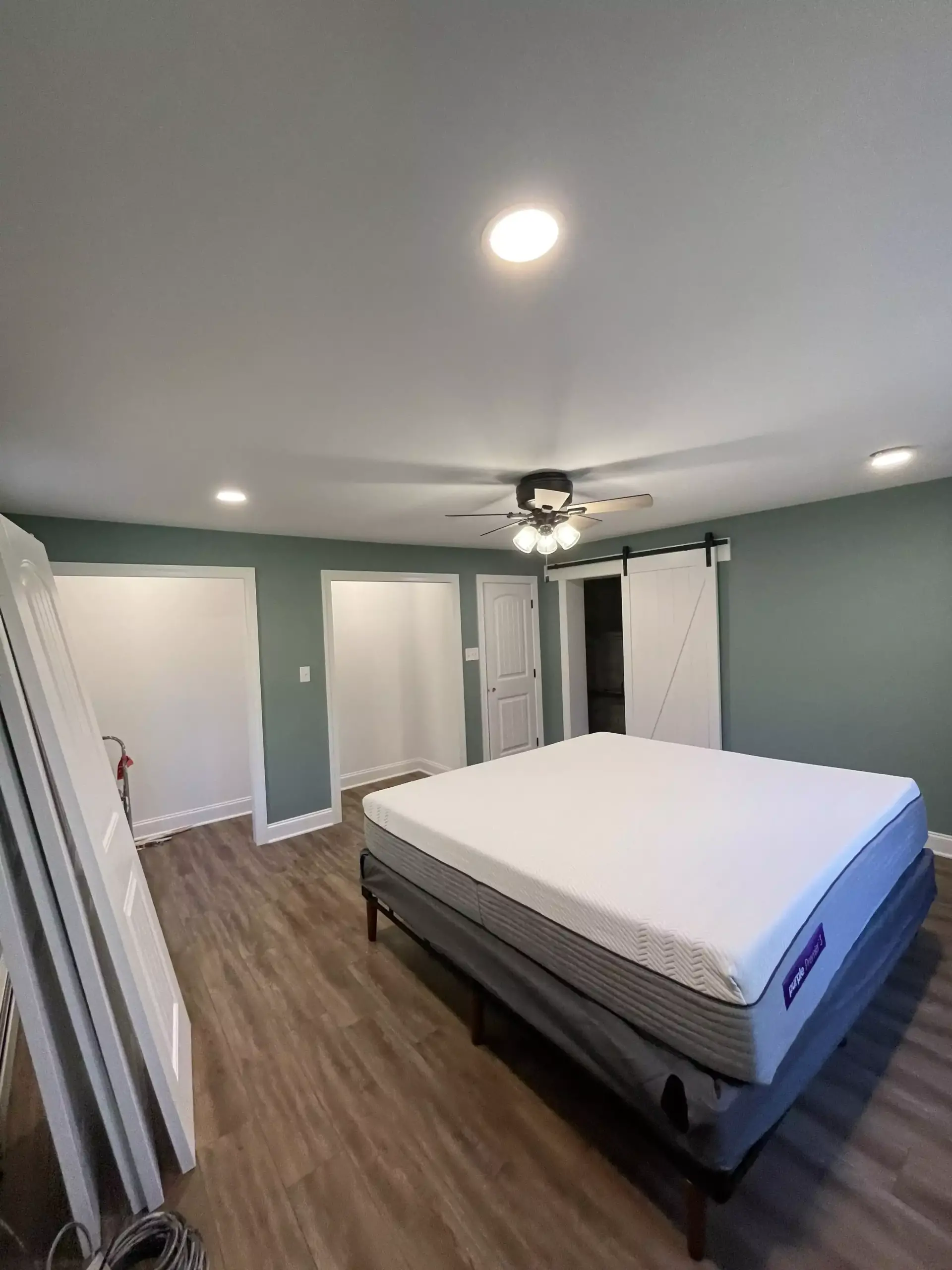 room with green walls and bed