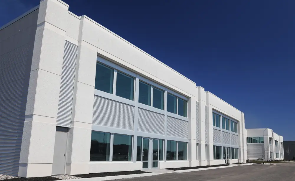 Exterior of a modern commercial building showcasing professional commercial painting with clean lines and large windows.